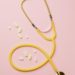 yellow stethoscope and medicines on pink background